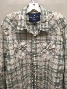 Blue snap button shirt tag