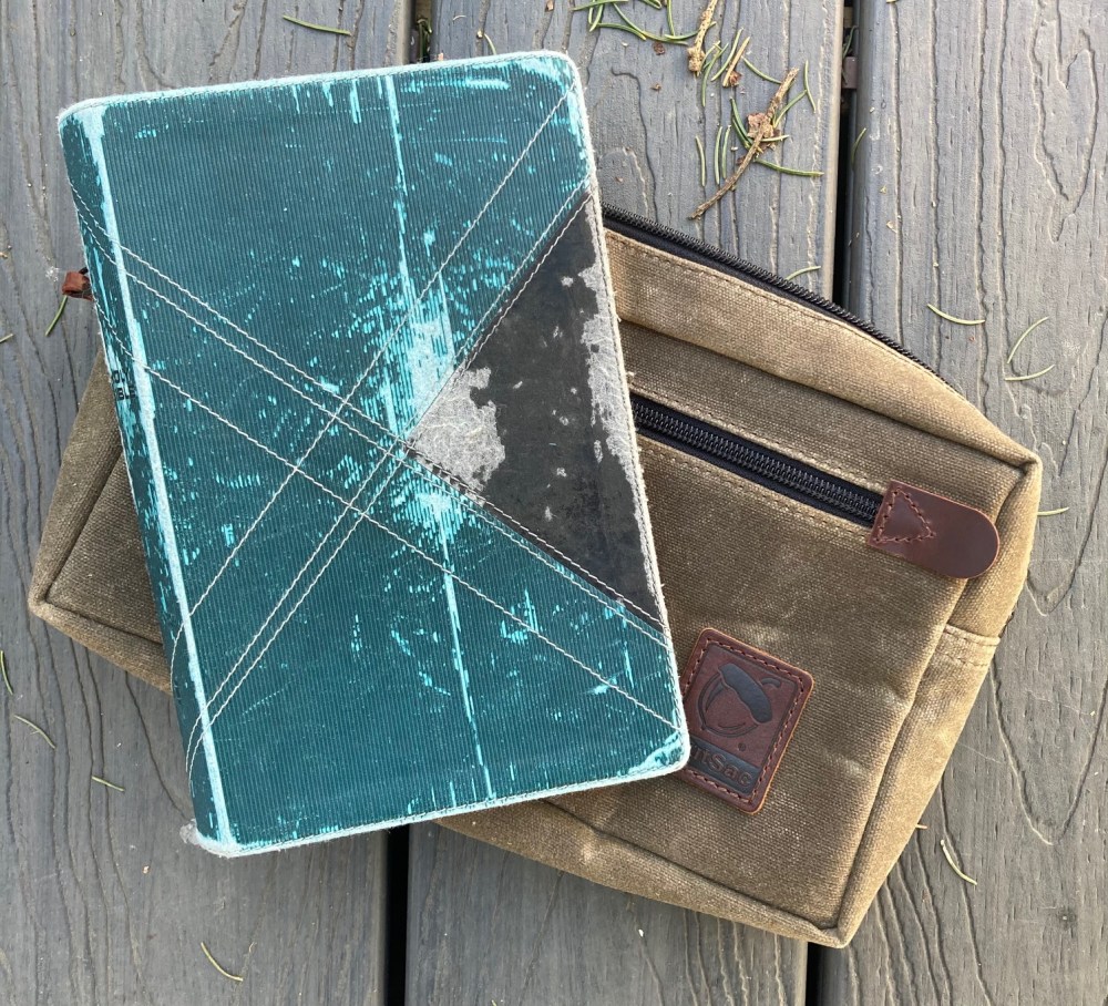 Side by side comparison of my well used NIV Thinline Bible with NutSac's Man-Bag, Dammit.