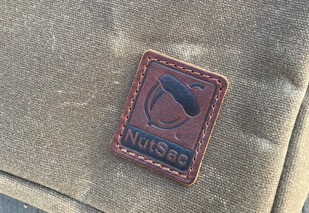 NutSac leather logo patched sewn to the front of the bag.