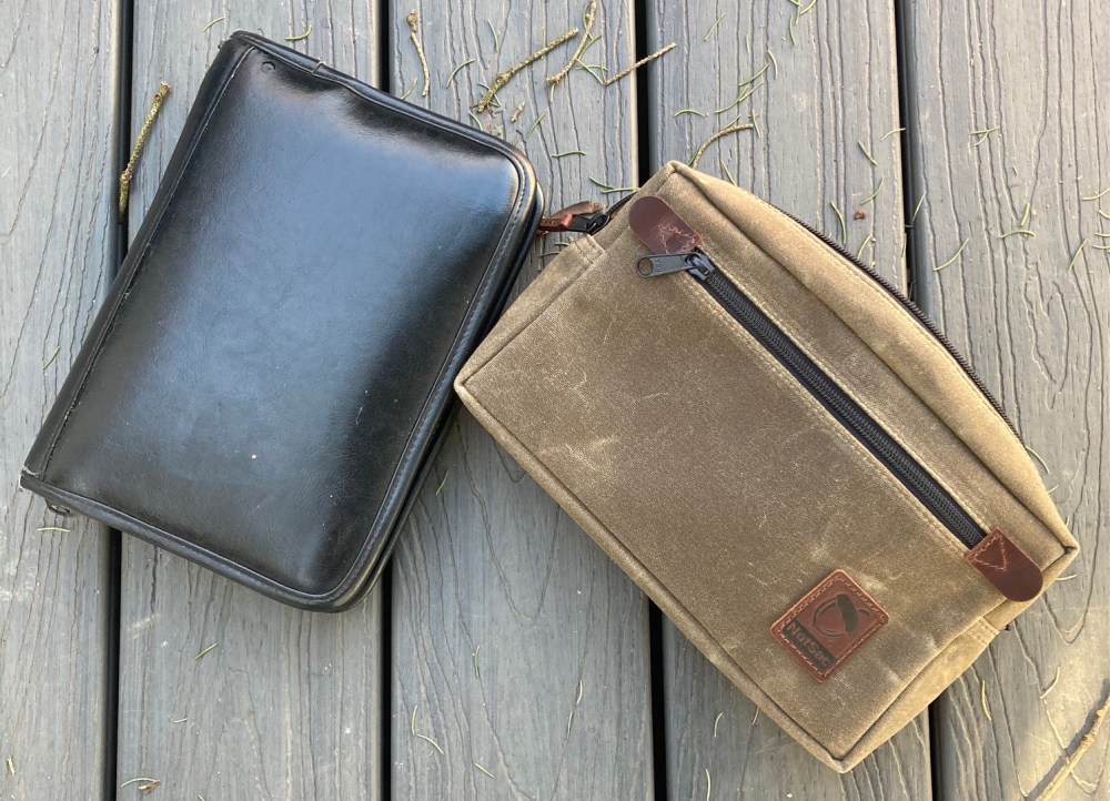 The Man-Bag, Dammit beside my worn out portfolio case used to carry my NIV Thinline Bible.